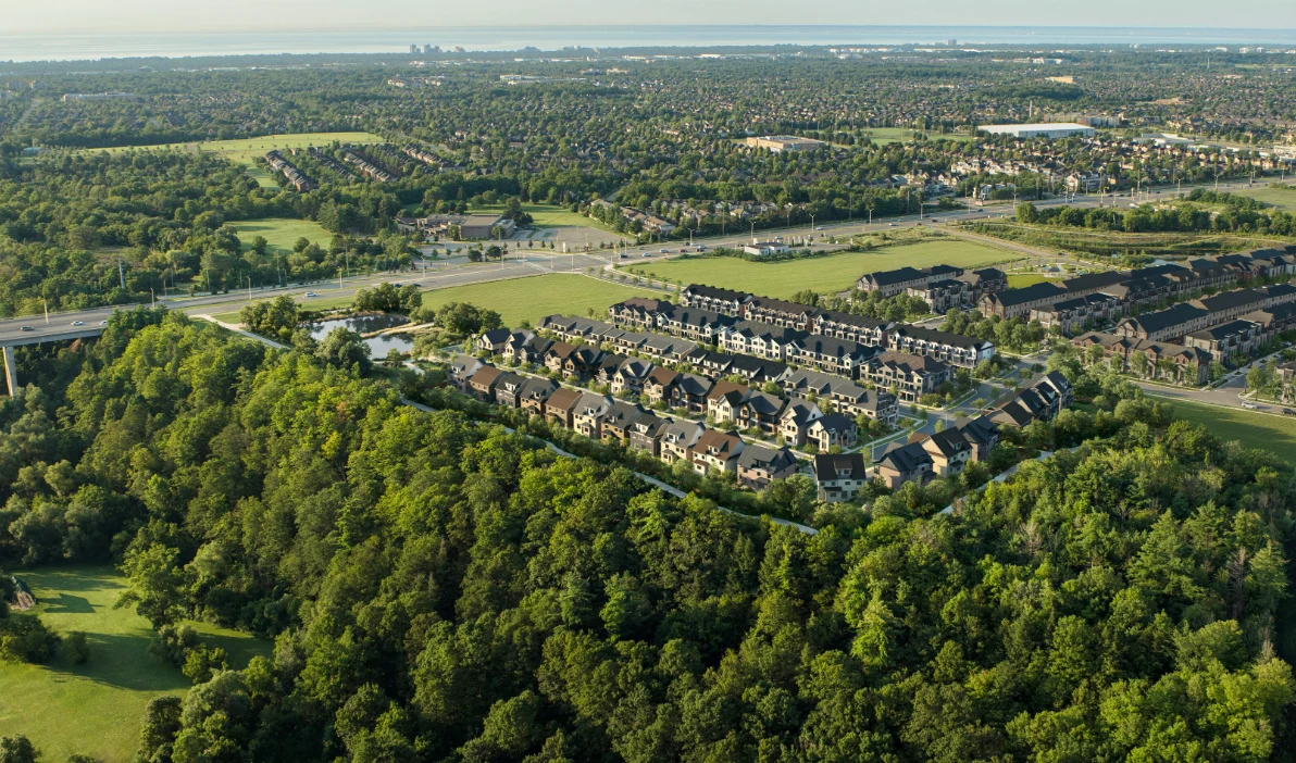 Aerial rendering of Five Oaks homes overlooking the wooded Sixteen Mile Creek valley